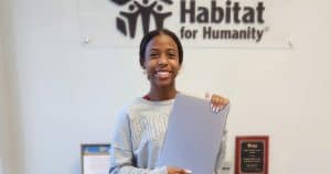 Young woman holding laptop